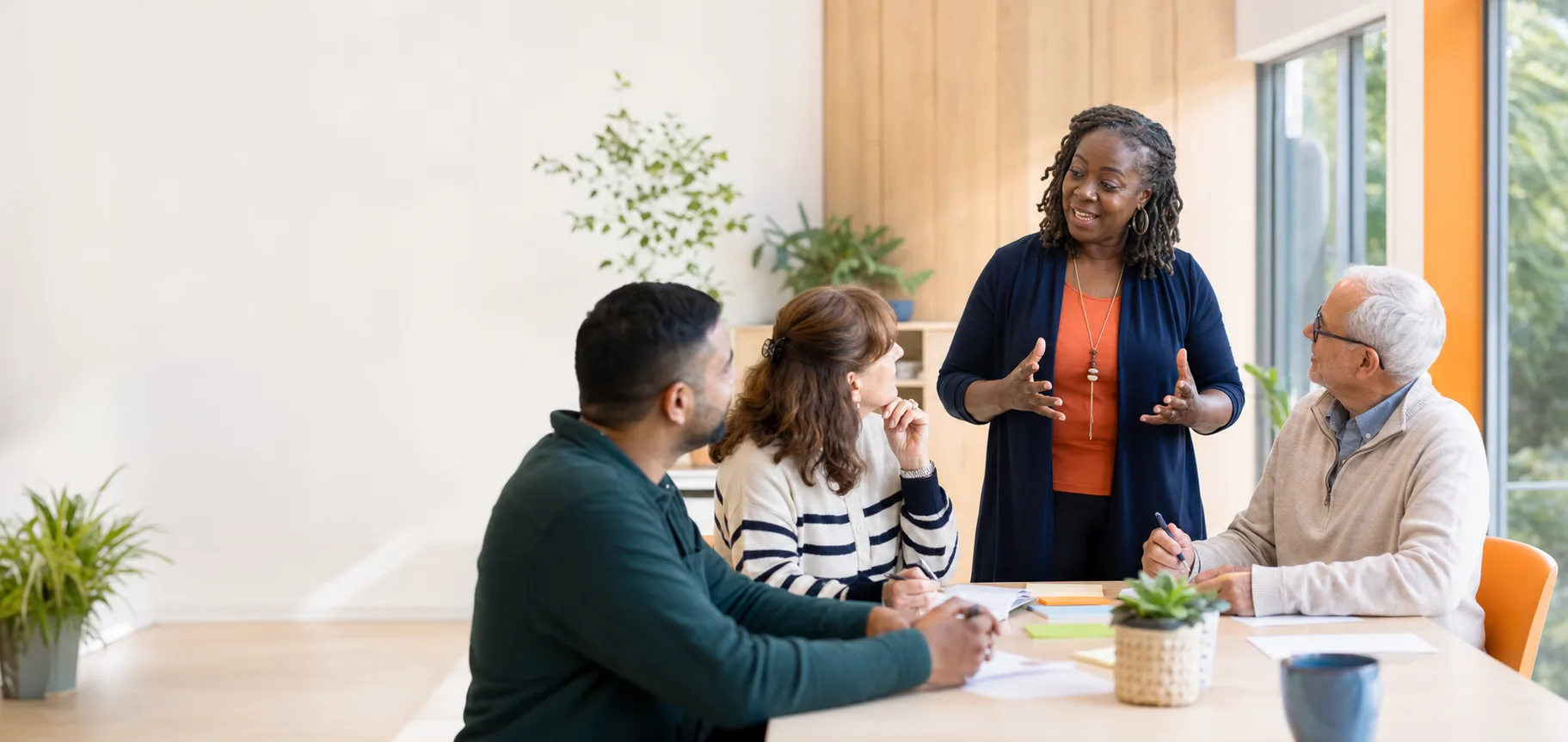 A facilitator leading a community support workshop